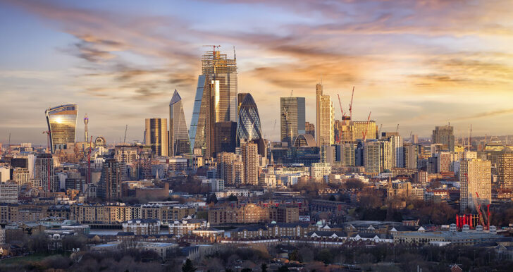 Sunrise over the urban skyline of the City of London, UK