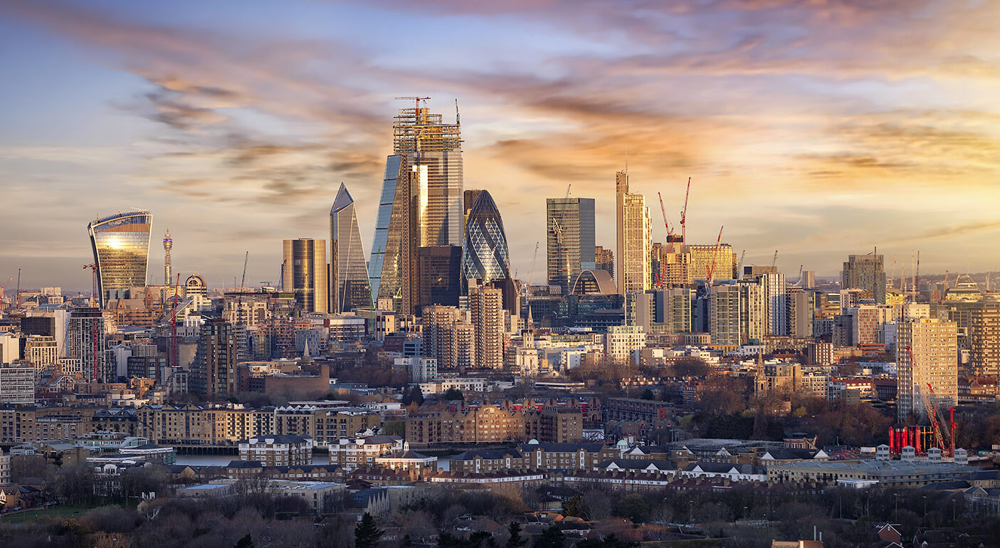 Sunrise over the urban skyline of the City of London, UK