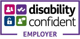 Disability Confident Employer logo with four icons: people, checkmarks, unlocked padlock, and a person with a speech bubble. Suitable for K-10 settings. Text reads disability confident EMPLOYER in black and purple.